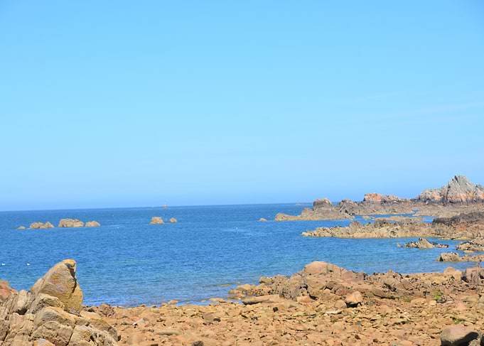 Rocky Coastline Under a Clear Blue Sky
