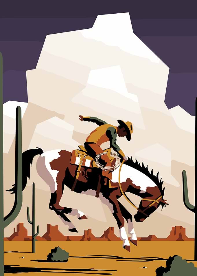 Cowboy riding a bucking horse in the desert