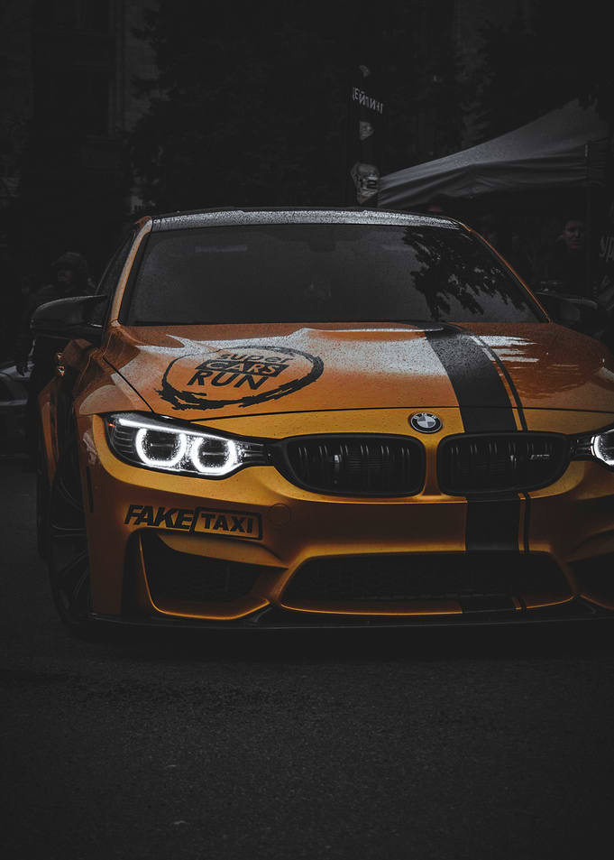 Yellow BMW M4 with Racing Decals