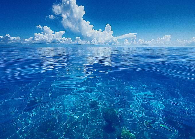 Crystal Clear Ocean Under Blue Sky