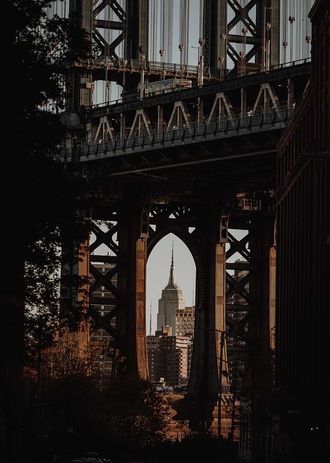 Empire State Building framed by the Manhattan Bridge