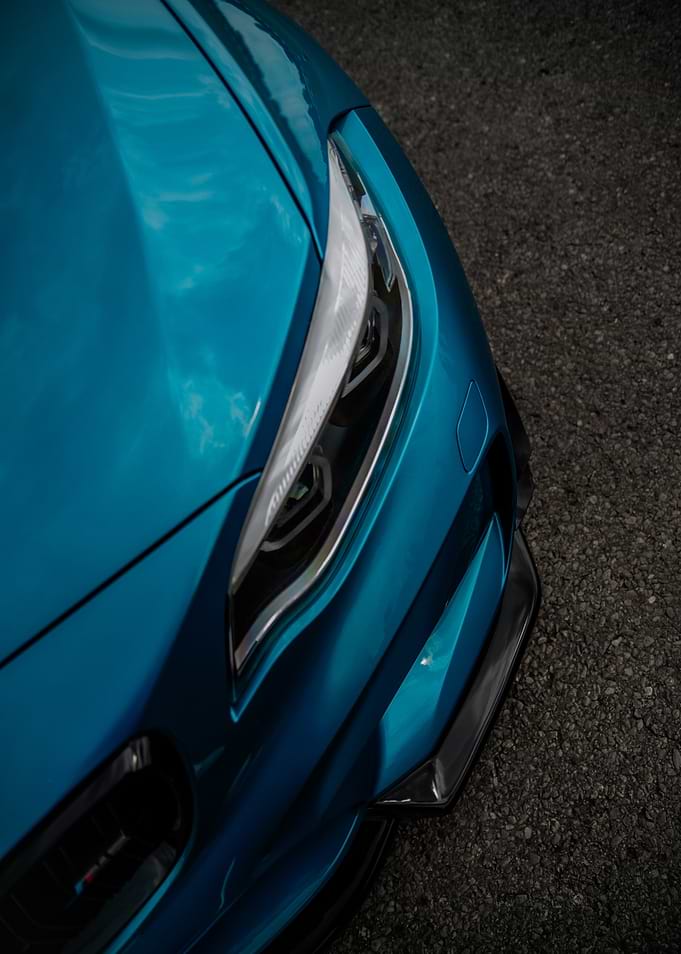 Close-up of a Teal Sports Car Headlight BMW M2