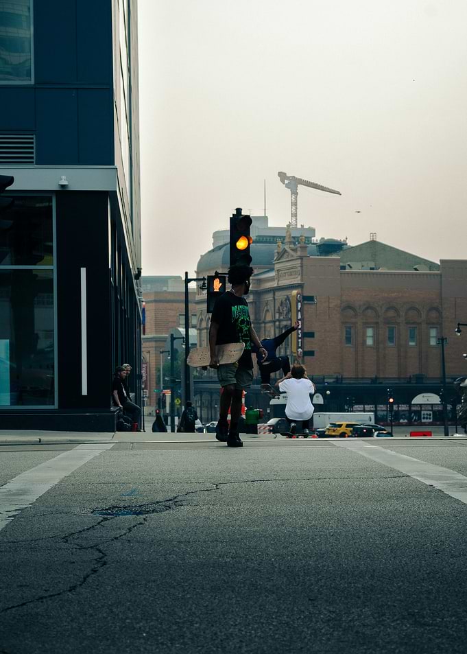 Skateboarders at a City Intersection