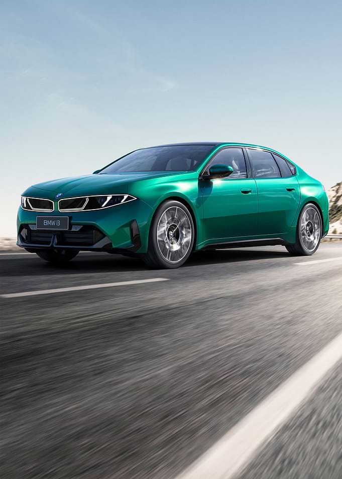Green BMW Sedan on a Highway