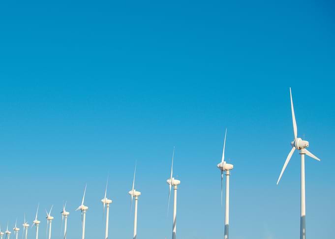 Wind Turbines Against Blue Sky