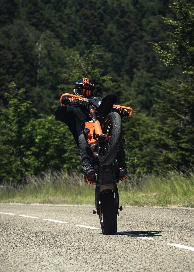 Motorcyclist performing a wheelie