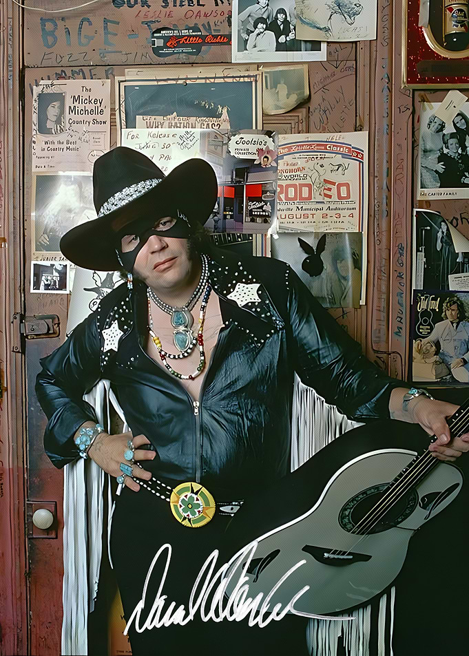 David Allan Coe in Cowboy Attire with Guitar