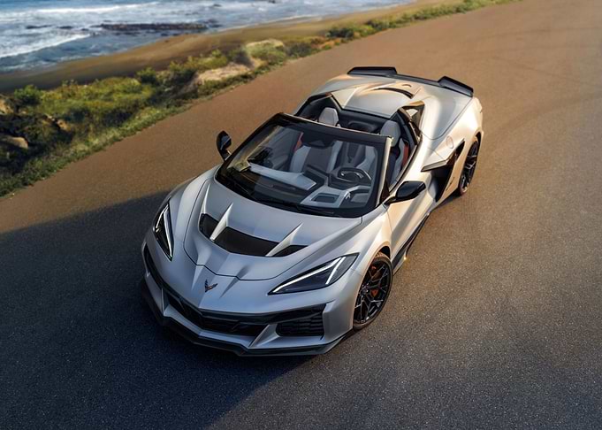Silver Convertible Corvette on Coastal Road