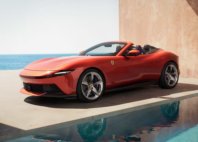 Orange Ferrari Roma Spider by the Pool
