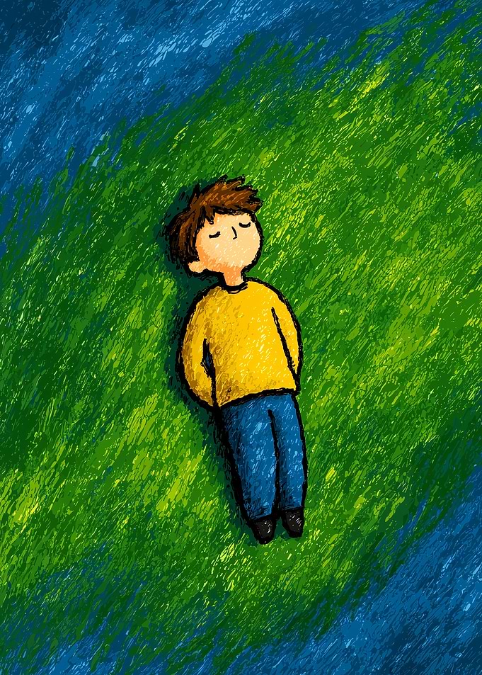 Boy resting on grass