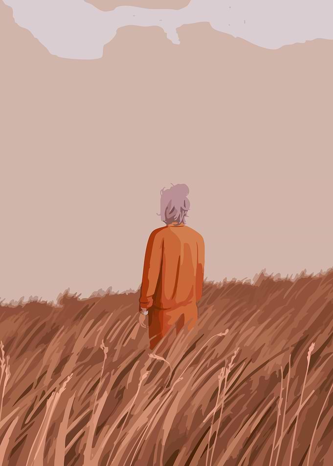 Person in a field of tall grass