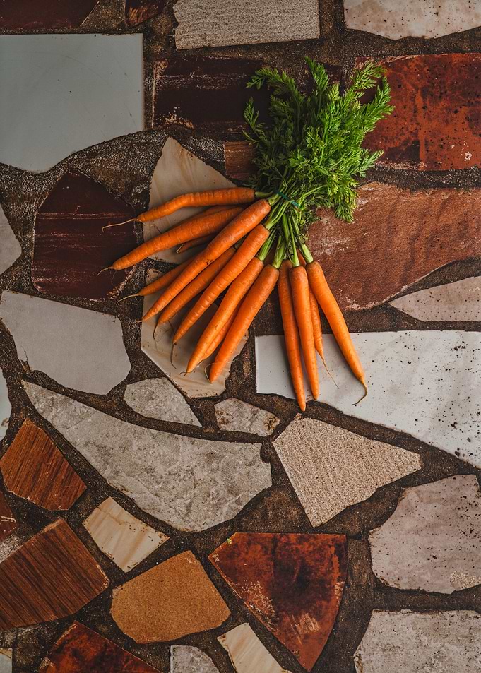Fresh Carrots on a Mosaic Surface