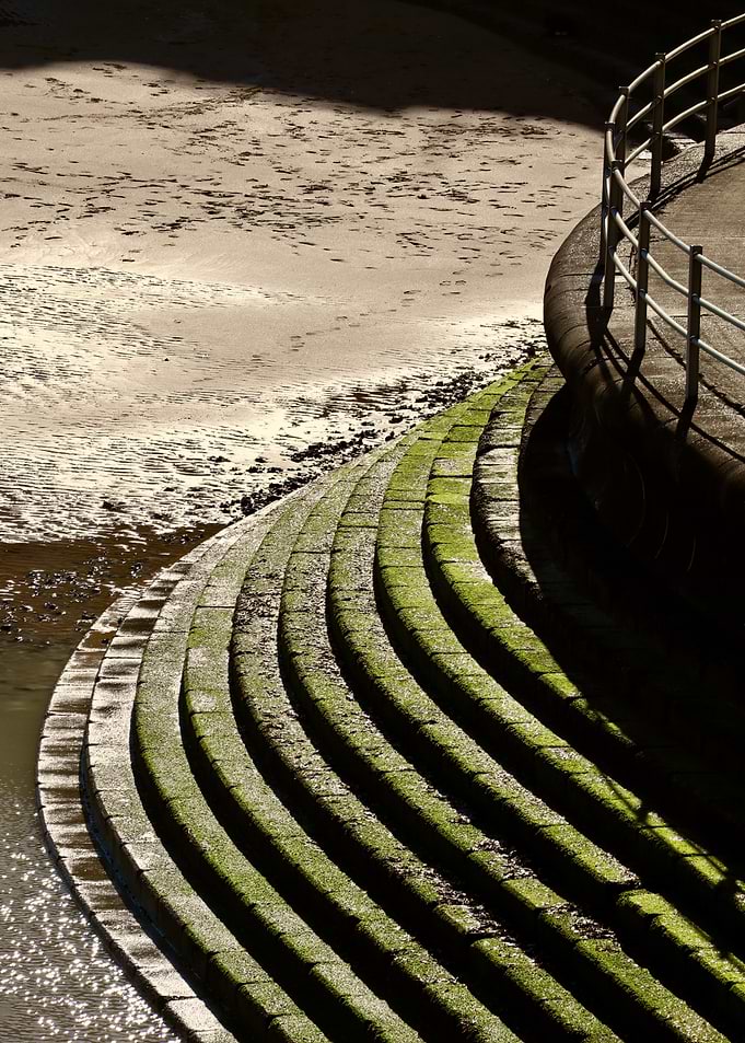 Mossy steps by the water