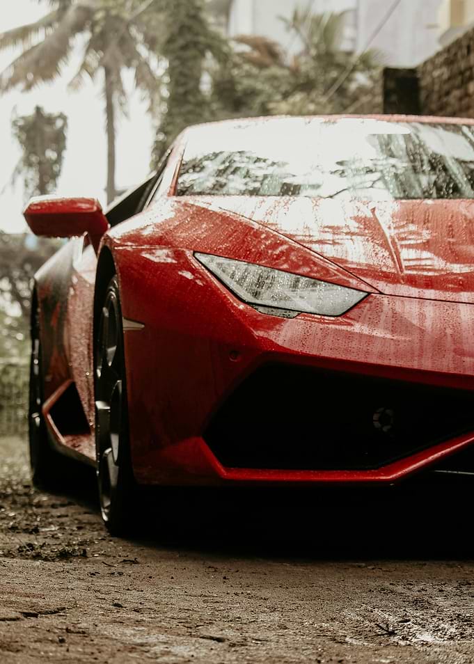 Red Sports Car in Rain