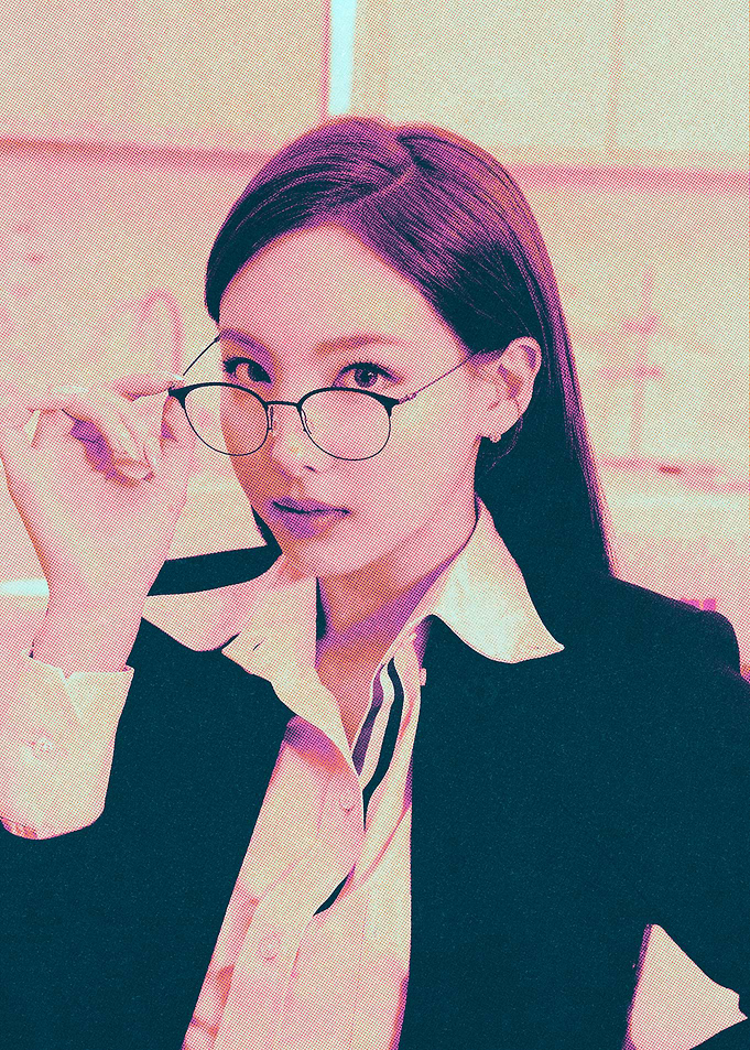 Woman in glasses and suit