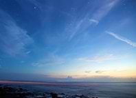 Twilight Sky Over Rocky Coastline