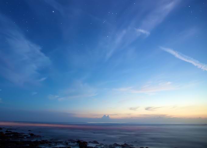 Twilight Sky Over Rocky Coastline