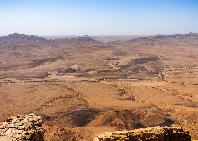 Vast Desert Landscape with Mountains