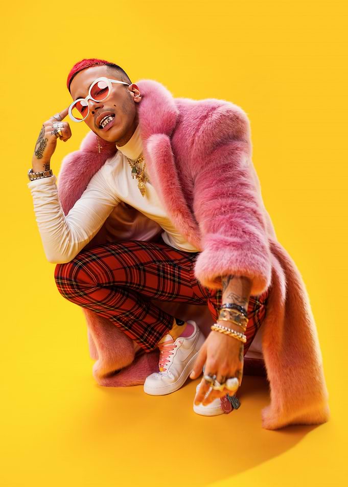 Man in Pink Fur Coat and Plaid Pants