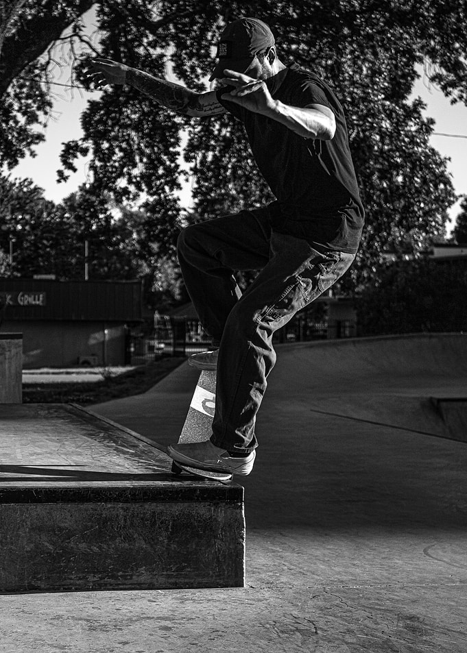 Skateboarder performing a trick at a skatepark