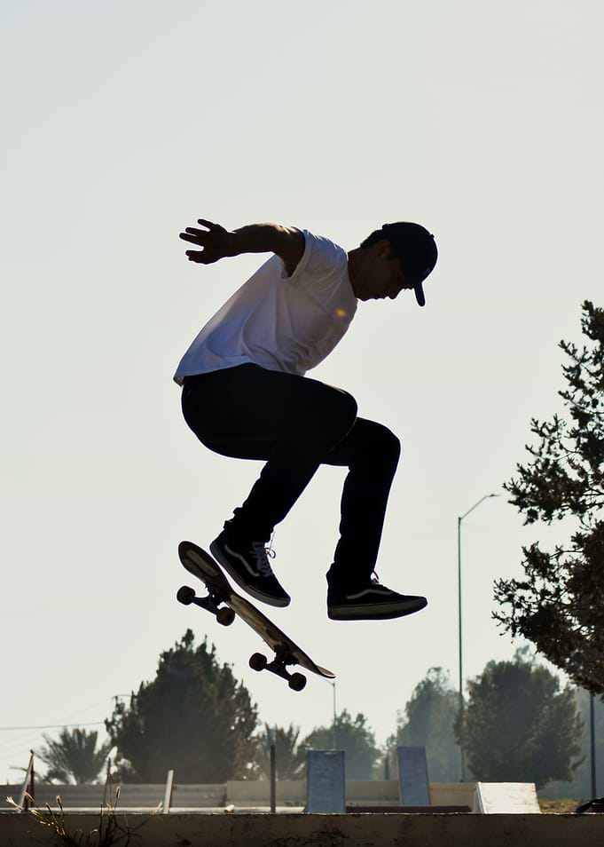 Skateboarder performing a jump trick