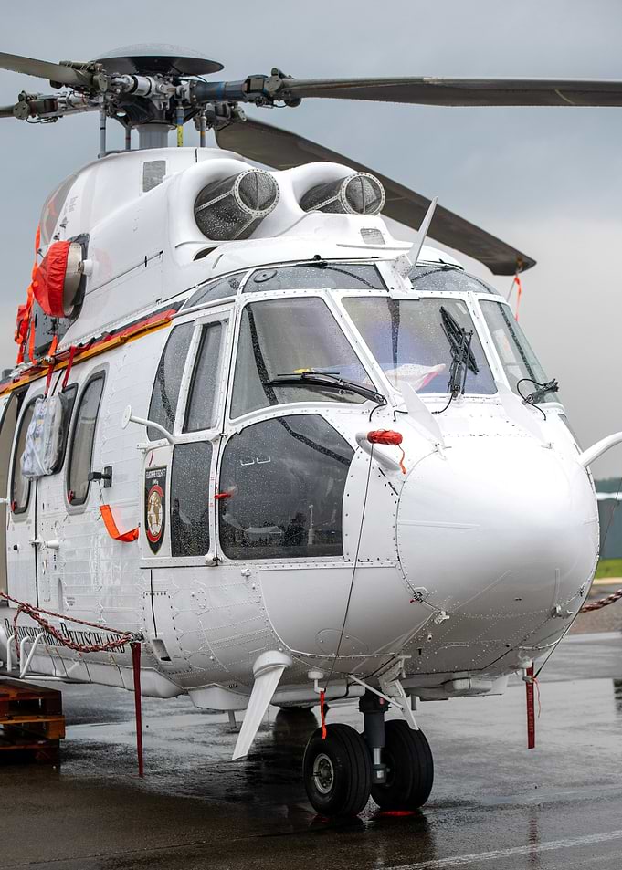 White Helicopter on Wet Tarmac