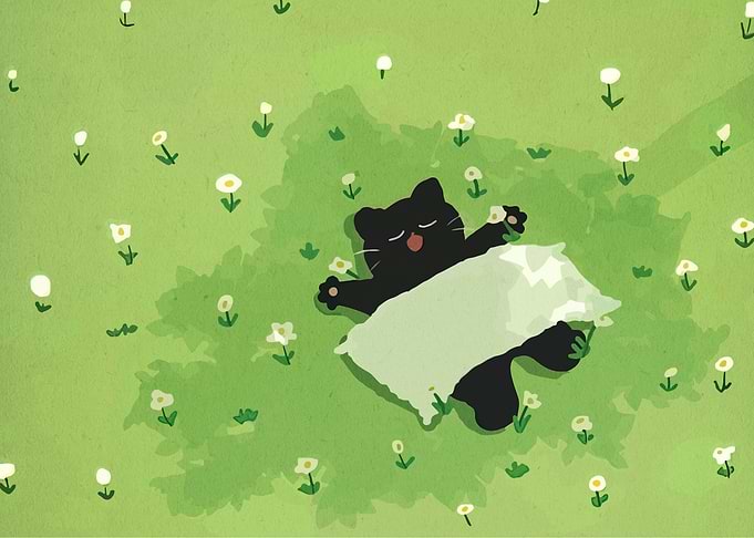 Black cat sleeping in a field of flowers