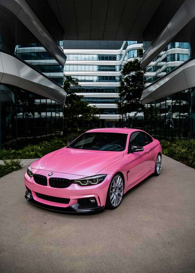Pink BMW Coupe in Modern Architecture