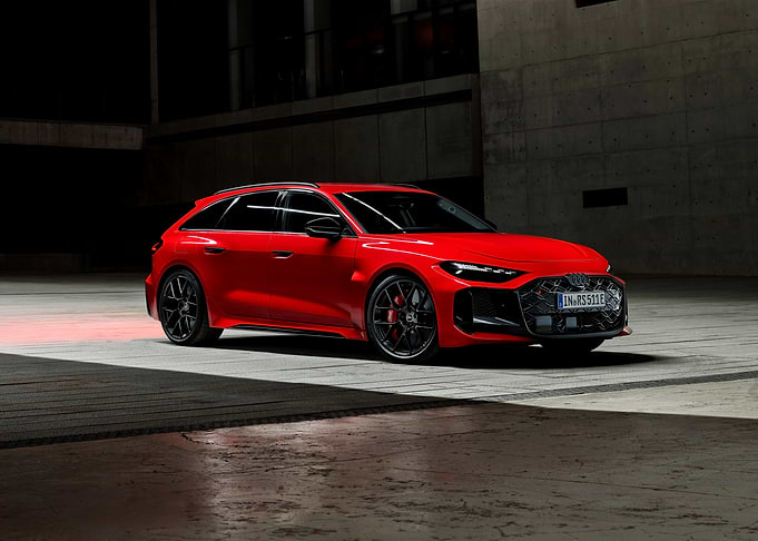 Red Audi RS6 Avant in Industrial Setting