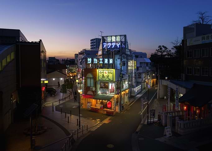 Neon-lit Japanese Izakaya in Ikebukuro (Tokyo) street at dusk