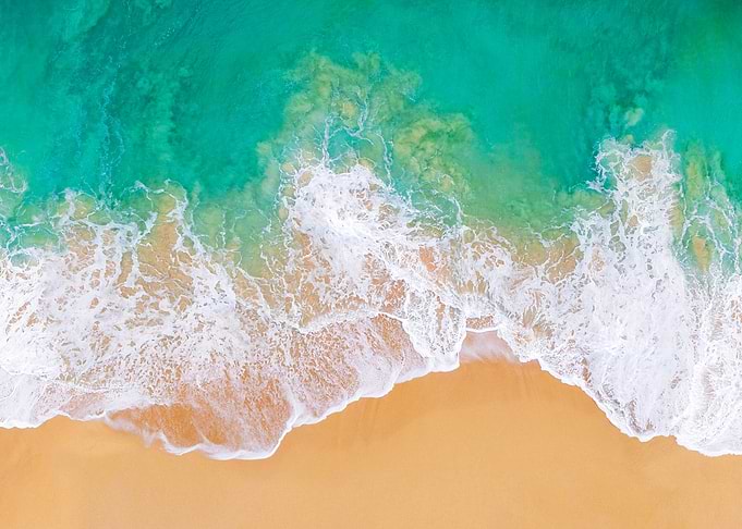 Aerial View of Tropical Beach Waves