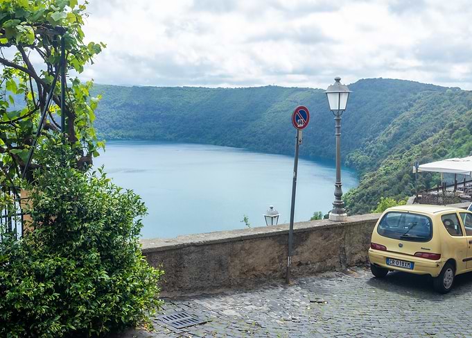 Scenic Lake View with Yellow Car