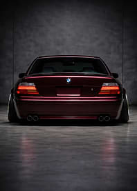 Rear View of a Maroon BMW Sedan