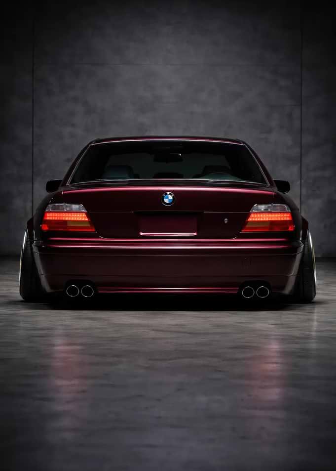 Rear View of a Maroon BMW Sedan