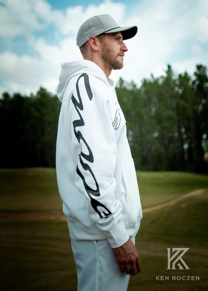Man in White Hoodie on Golf Course