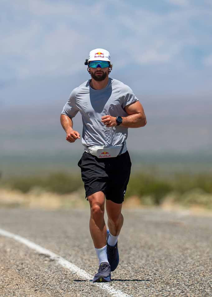 Athlete running on a desert road