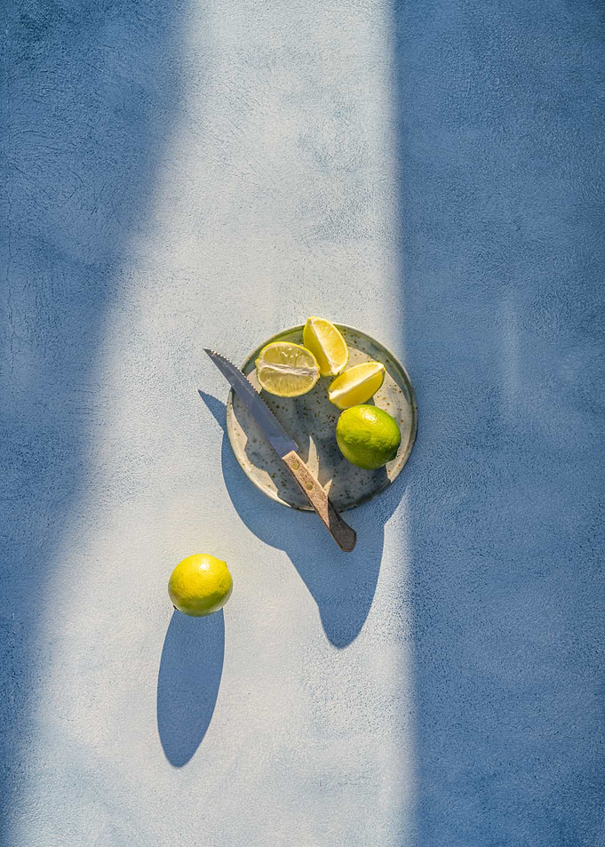 Limes on a Plate with Knife