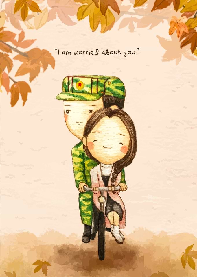 Couple on a bicycle with autumn leaves
