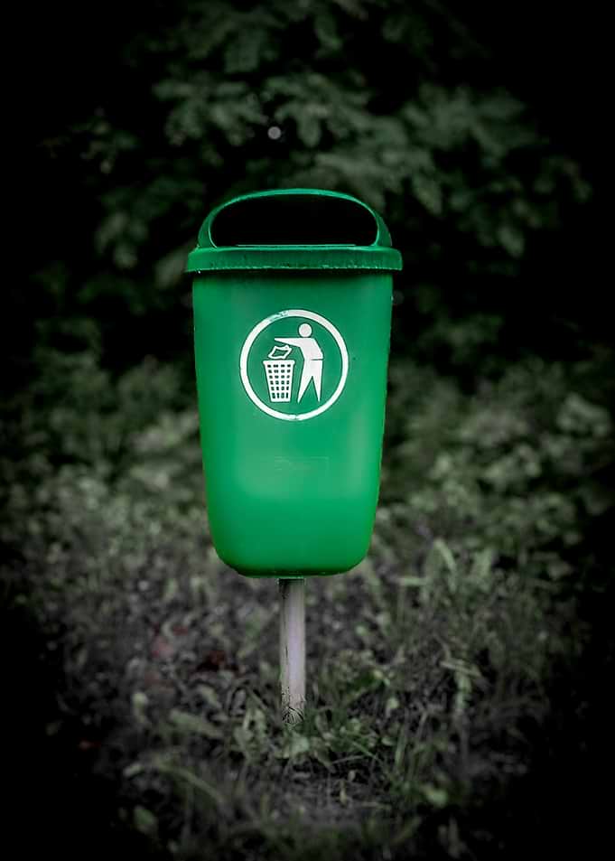 Green Trash Can with Recycling Symbol