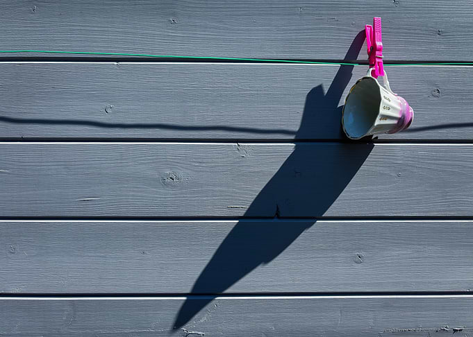 Mug hanging on a clothesline
