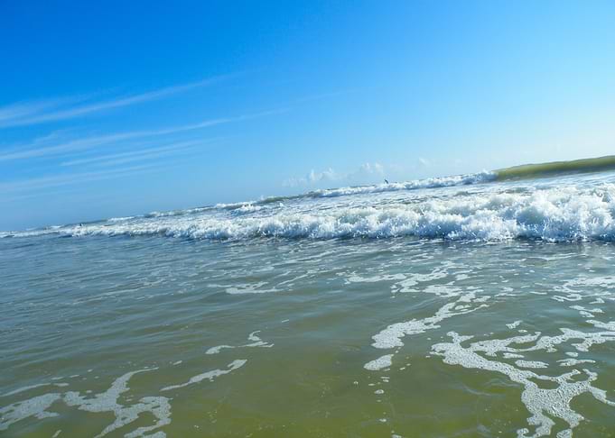 Ocean waves under a blue sky
