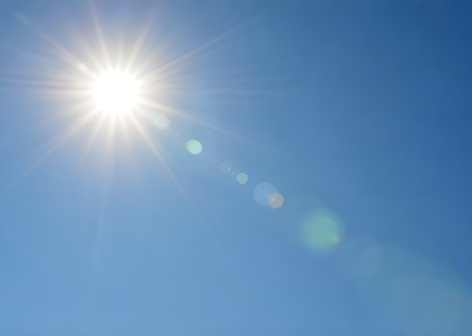 Bright Sun Shining in a Clear Blue Sky