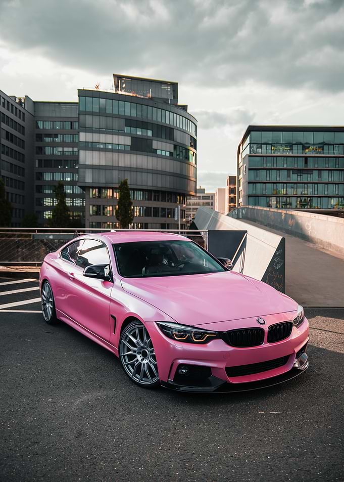Pink BMW Coupe in Urban Setting