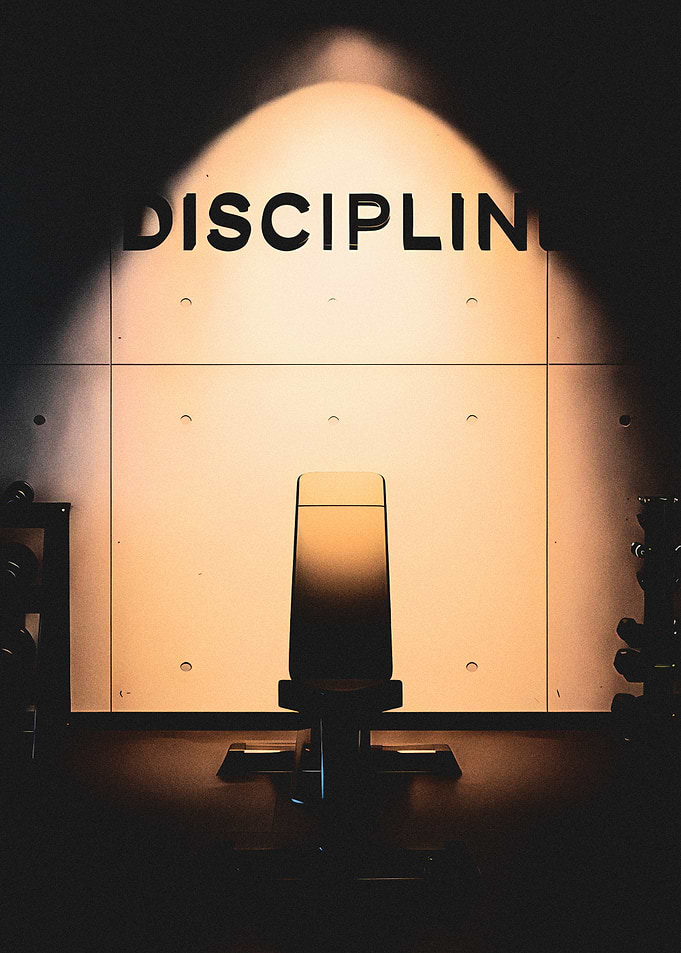 Gym Bench with 'DISCIPLINE' Sign