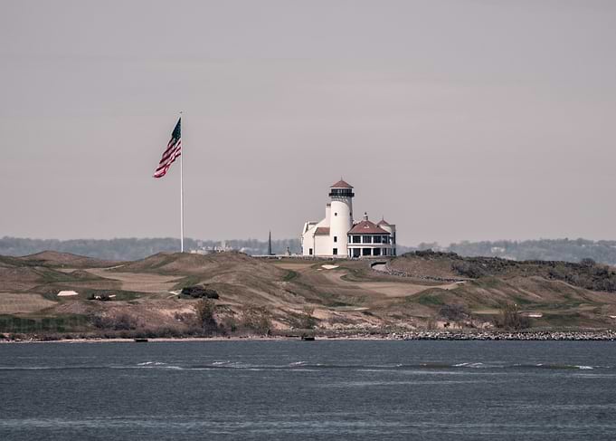 Lighthouse and American Flag on Golf Course