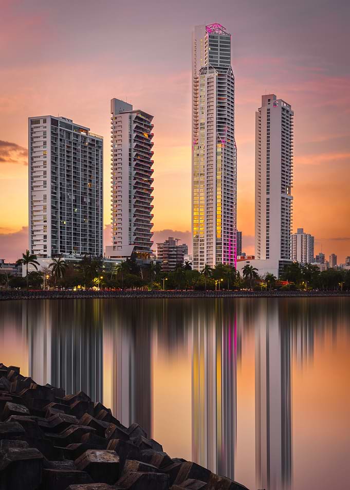 Panama City Skyline Reflected in Water at Sunset