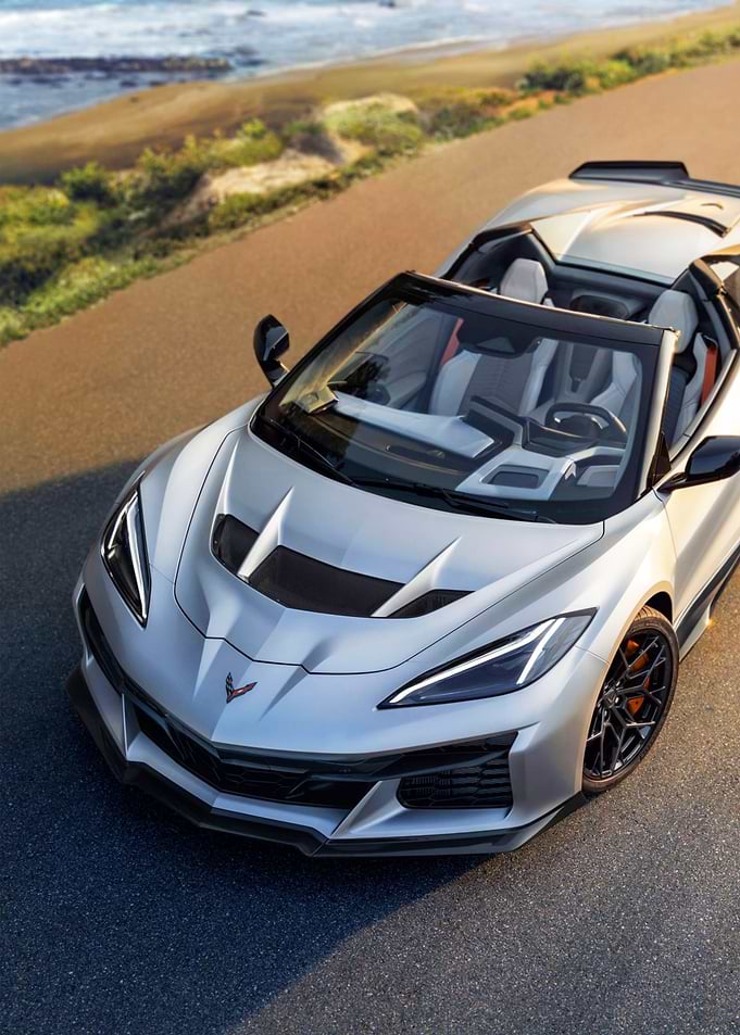 Silver Convertible Corvette on Coastal Road