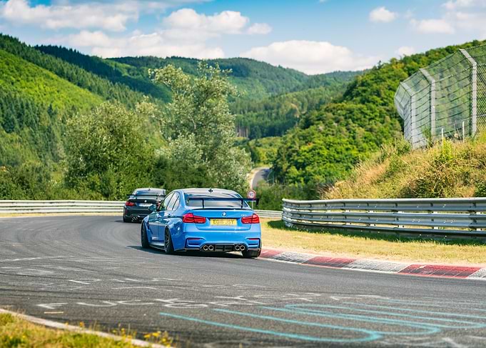 Blue BMW M3 on a Race Track