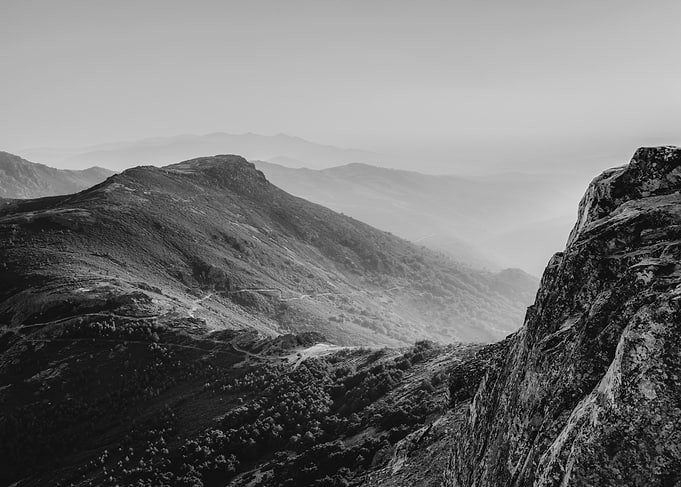 Misty Mountain Range at Sunrise