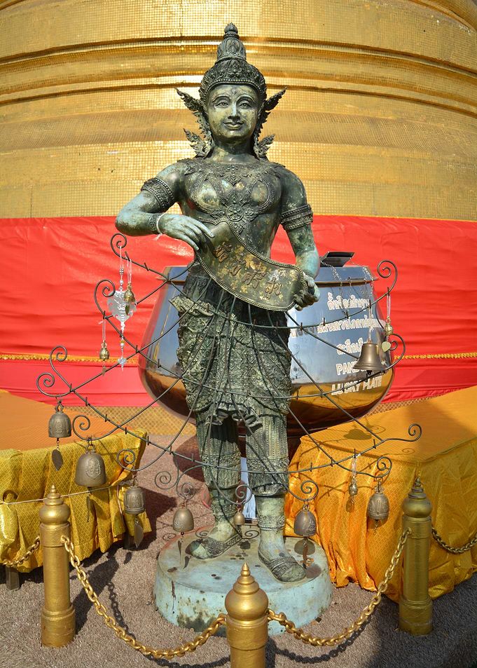 Bronze Statue with Bells and Golden Background